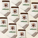 Pattern of socks with teddy bear design and 'elliosa' branding on a beige background