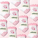 Collage of white socks with pink bow shaped grips on the soles, with the words "pilates princess" embroidered around images of a butterfly, a drink and shopping bags, with 'elliosa' branding on the packaging.