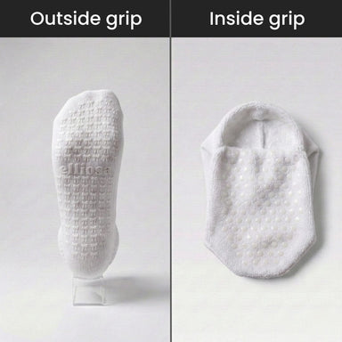 White socks showing 'ellipso' branding on a gray background, divided into 'Outside grip' and 'Inside grip' sections.