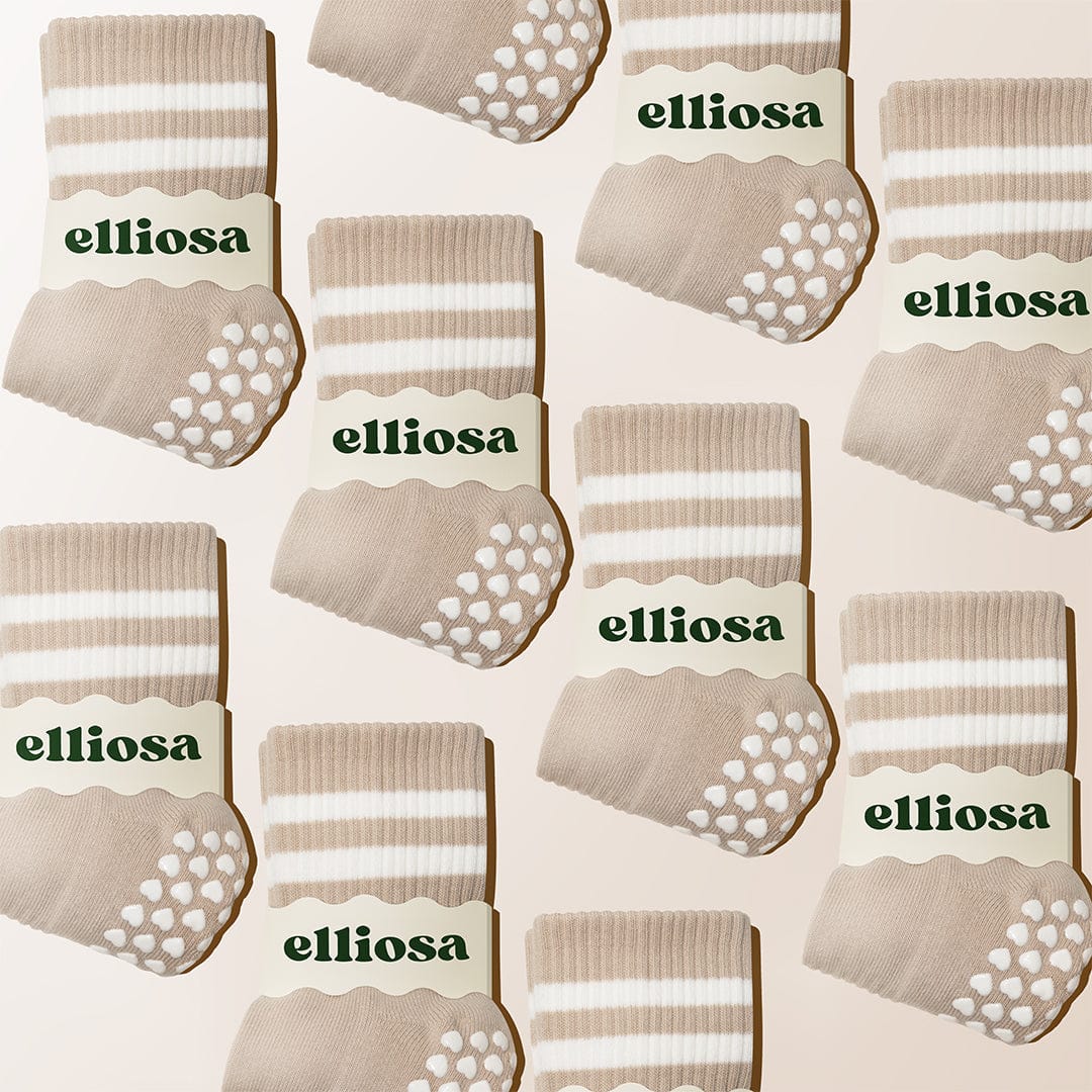 Pattern of beige socks with white stripes and 'elliosa' branding on a beige background.