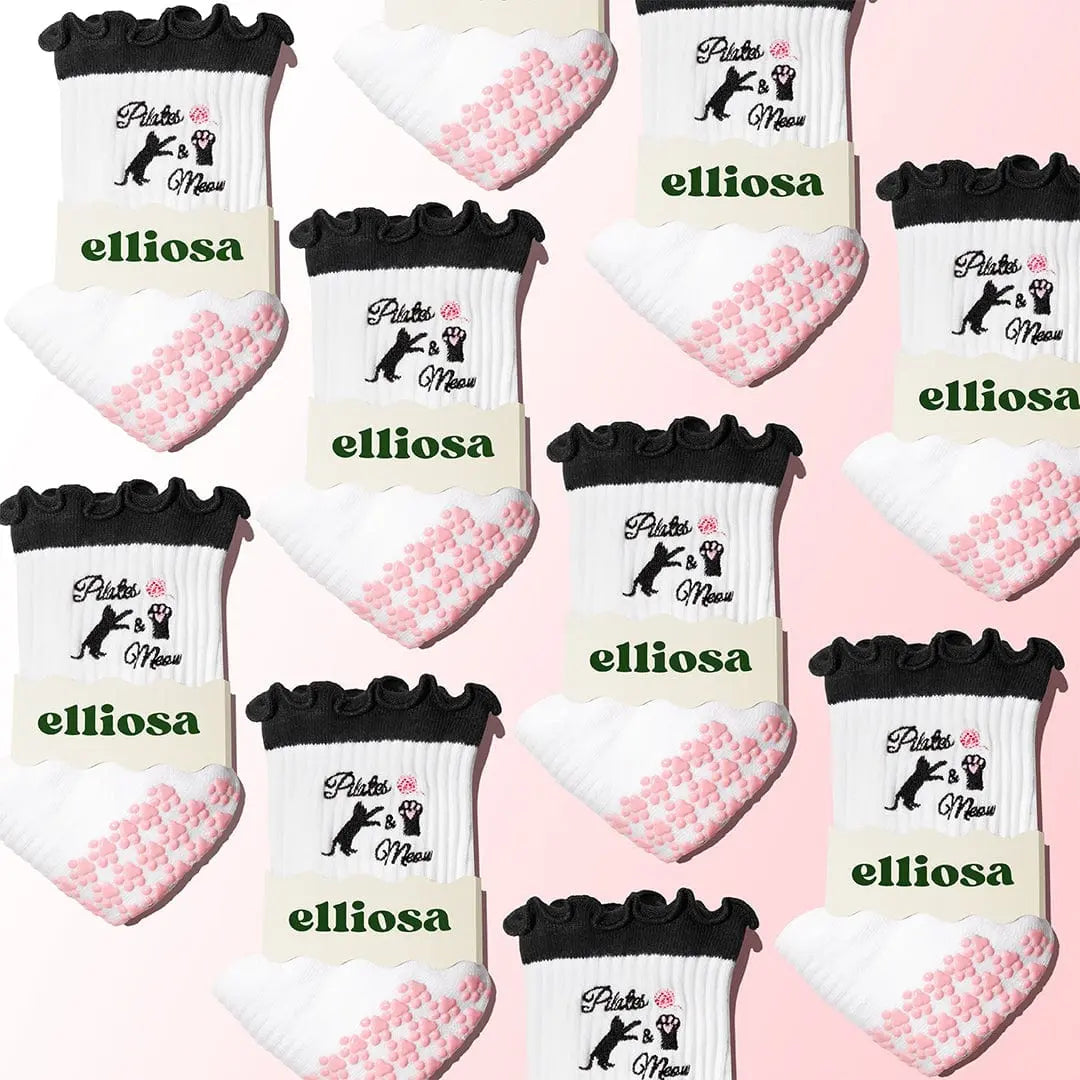 Multiple pairs of black, white and pink socks with 'elliossa' branding on a pink background