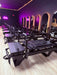 Dark Pilates studio showing 7 Core Collab Sculptformers in black in front of arched mirrors.