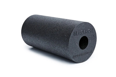 Black foam roller with a hole down the middle, with the blackroll branding on the end featuring the words "made in Germany".
