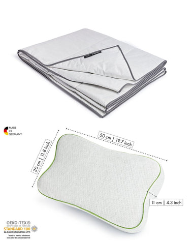 Contents of Blackroll infrared sleep set including Blackroll recovery pillow in white with green border and infrared blanket.