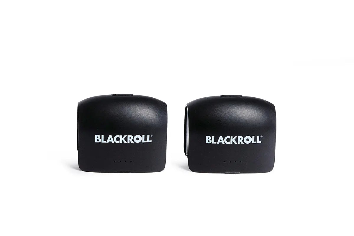 Two black infinity batteries for the Blackroll compression boots. 