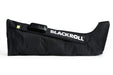 Blackroll compression boots side view on the floor, with white background.