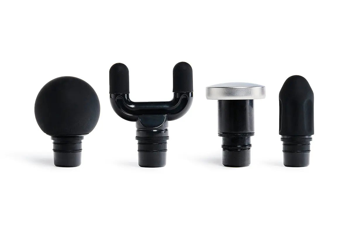 Set of four attachments for the blackroll fascia gun - one ball shaped, one U shaped, one metal flat topped and one pointy.