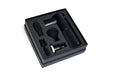 Blackroll fascia massage gun in box surrounded by foam padding with 4 attachments.
