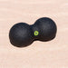 Blackroll peanut dual massage ball on the sand.
