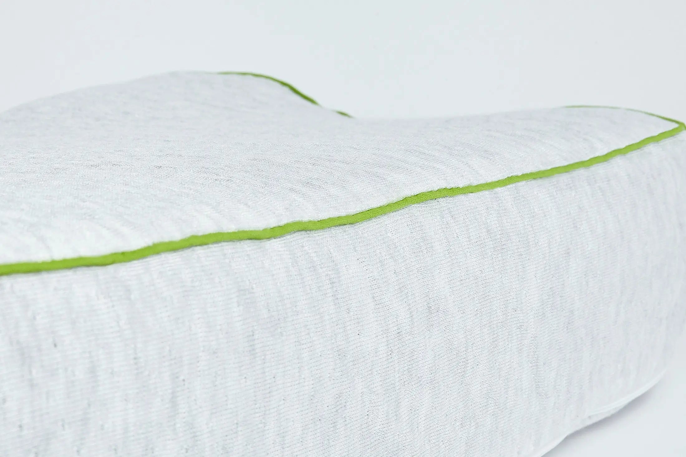 Close up of Blackroll recovery pillow showing the material and the green border.