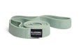 Green exercise resistance band with Blackroll logo on a white background.