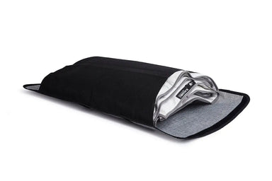 Light grey coloured Blackroll ultralite blanket folded and put inside black travel bag.