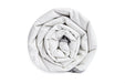 End view of a rolled up Blackroll ultralite blanket.