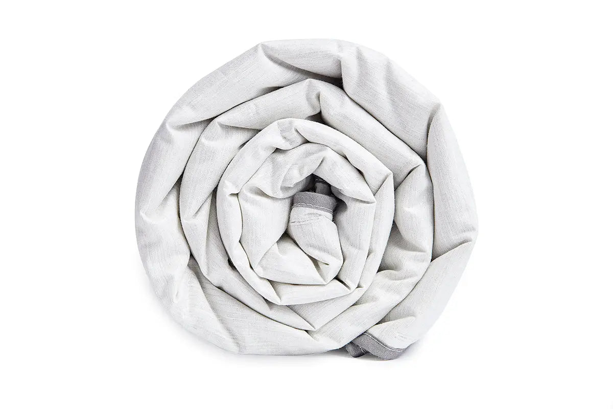 End view of a rolled up Blackroll ultralite blanket.