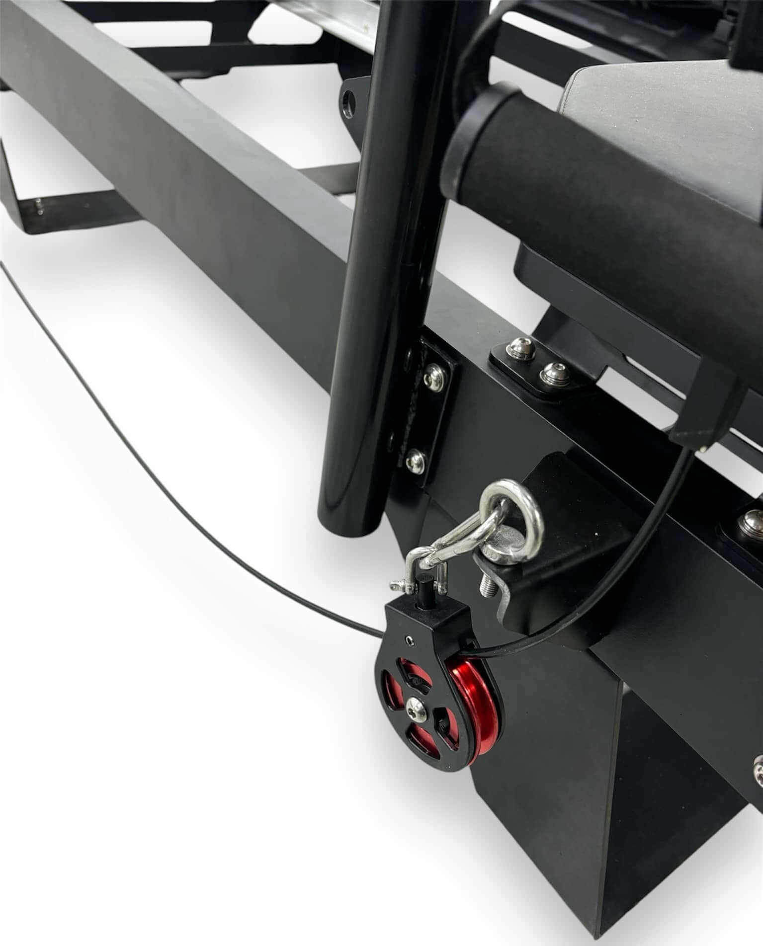 Close-up of the pulley system of the Core Collab Pilates Sculptformer on a white background.