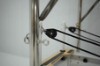 Close up of rope pulley on trapeze of queen reformer.