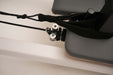 Close up of the straps on the Core Collab Queen Studio Pilates reformer, also showing the cleats.