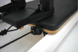 Close up on straps on the Queen reformer full trapeze, showing the head rest and shoulder pads.
