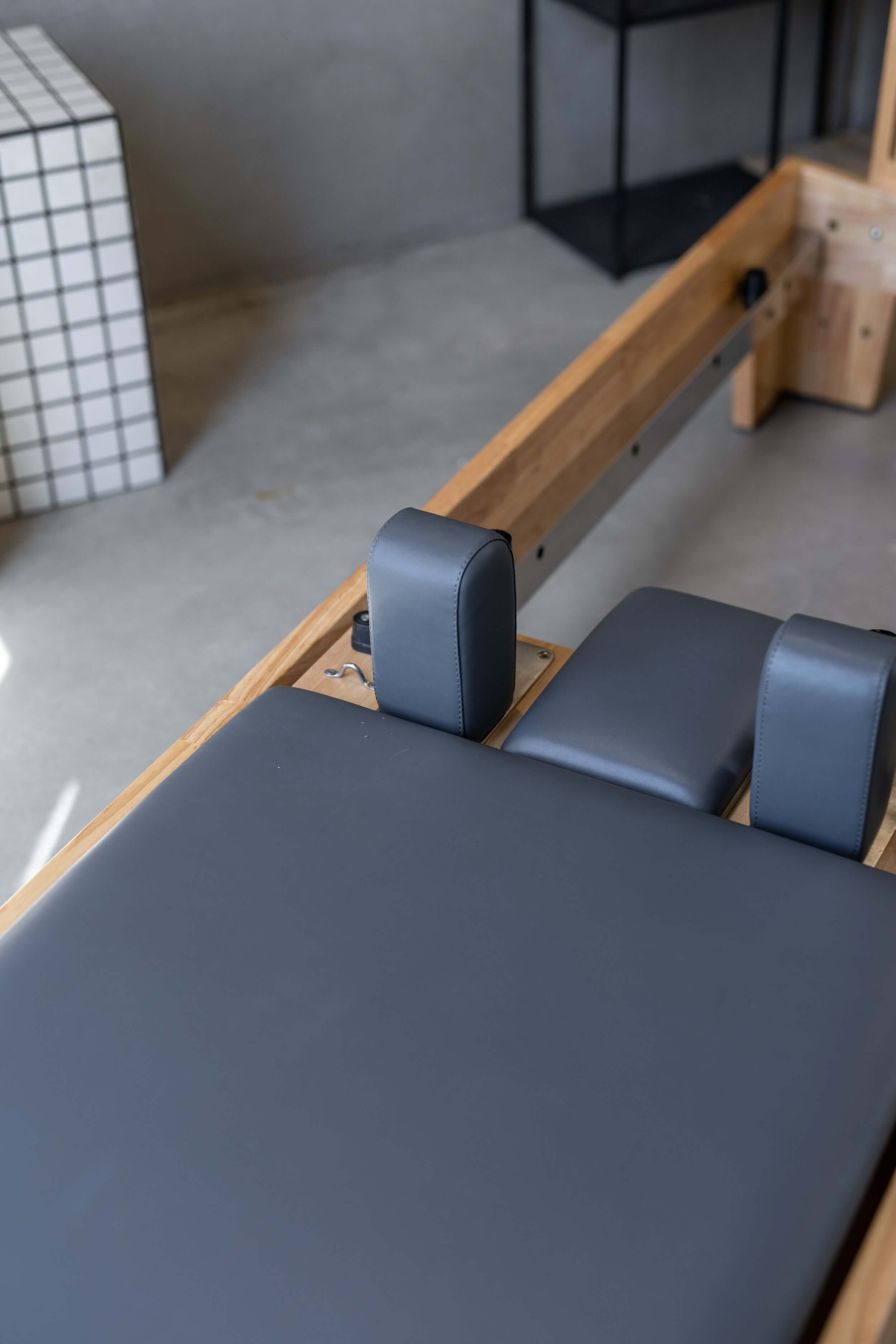 Close up of the charcoal upholstery on a Core Collab Eco Pilates Reformer.