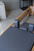 Close up of the charcoal upholstery on a Core Collab Eco Pilates Reformer.