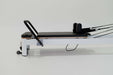 Core Collab Queen Studio Pilates reformer side view of the top half showing the white frame with black upholstery, with the footbar and shoulder rests in view.