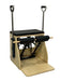 Pilates Wunda Chair by Core Collab showing dual foot pedal with two handles and black upholstery.