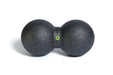 Close up of the Blackroll duo small peanut shaped massage ball.