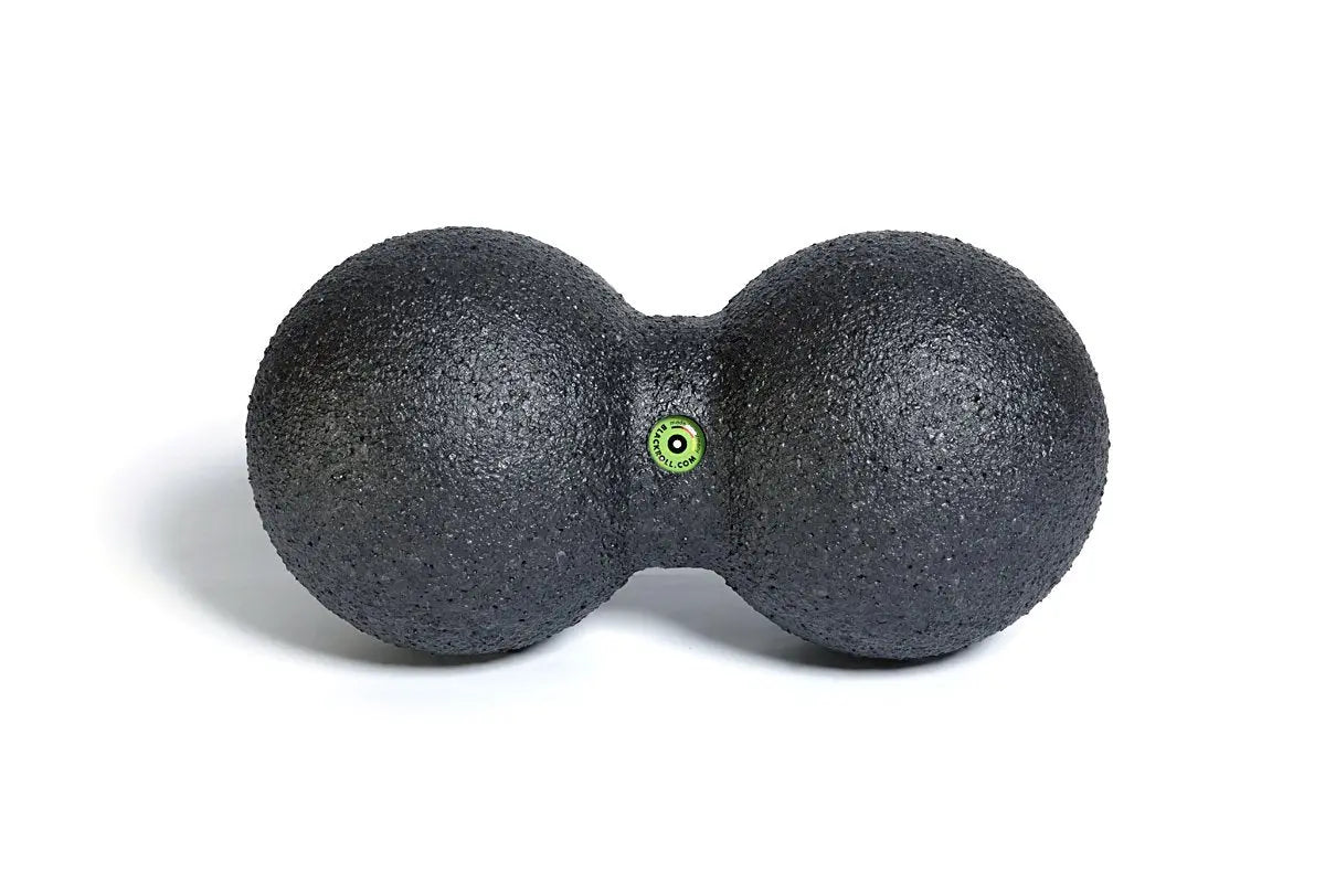 Close up of the Blackroll duo small peanut shaped massage ball.