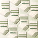 Elliosa Dual Direction Grip Socks in matcha cream laid in a pattern.