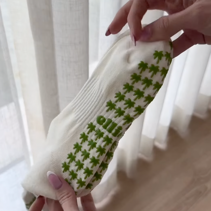 Pilates paradise socks showing palm tree shaped grips on the soles