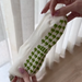 Pilates paradise socks showing palm tree shaped grips on the soles