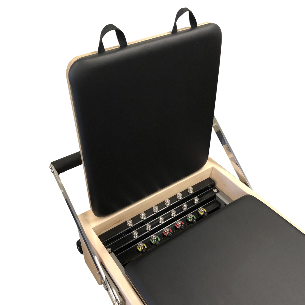 Close up of pilates reformer at foot end with 6 colour coded springs showing.