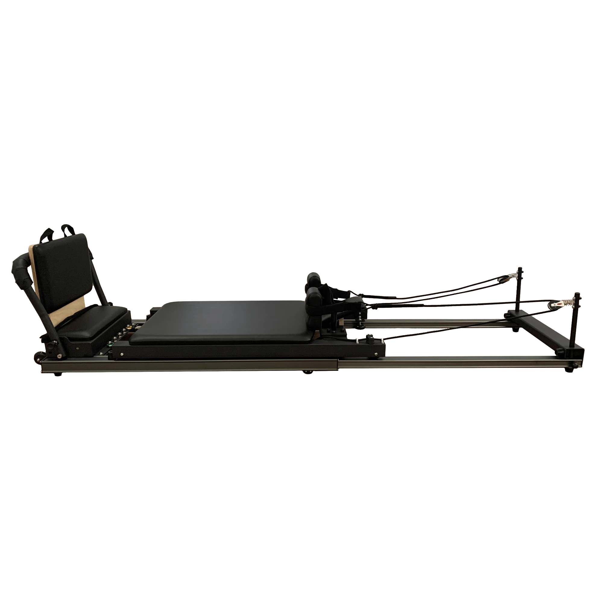 Black pilates reformer side on view on a white background.