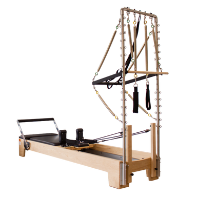 Pilates reformer with half trapeze attachment.