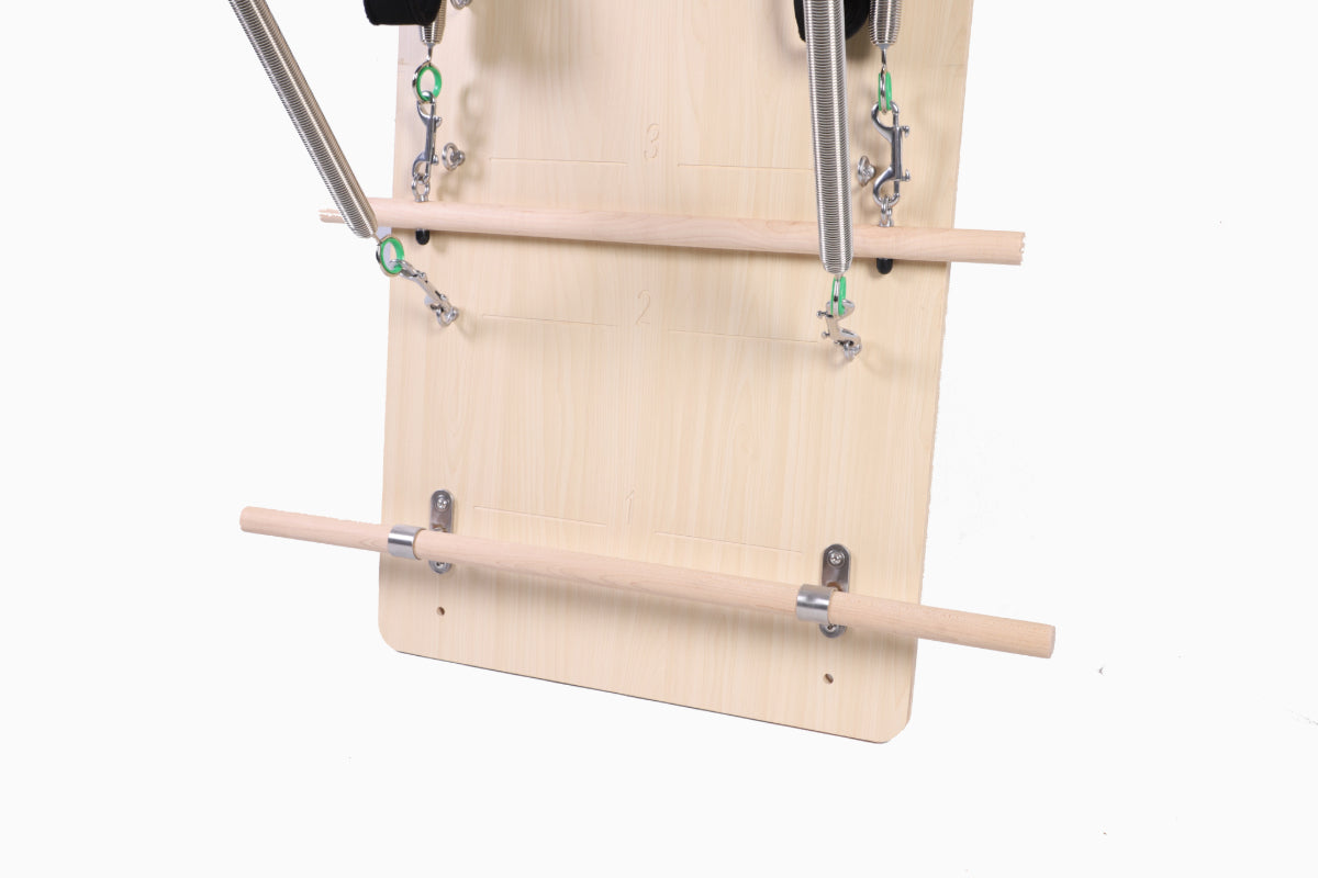 Close up of light coloured wooden springboard with silver and black attachments.