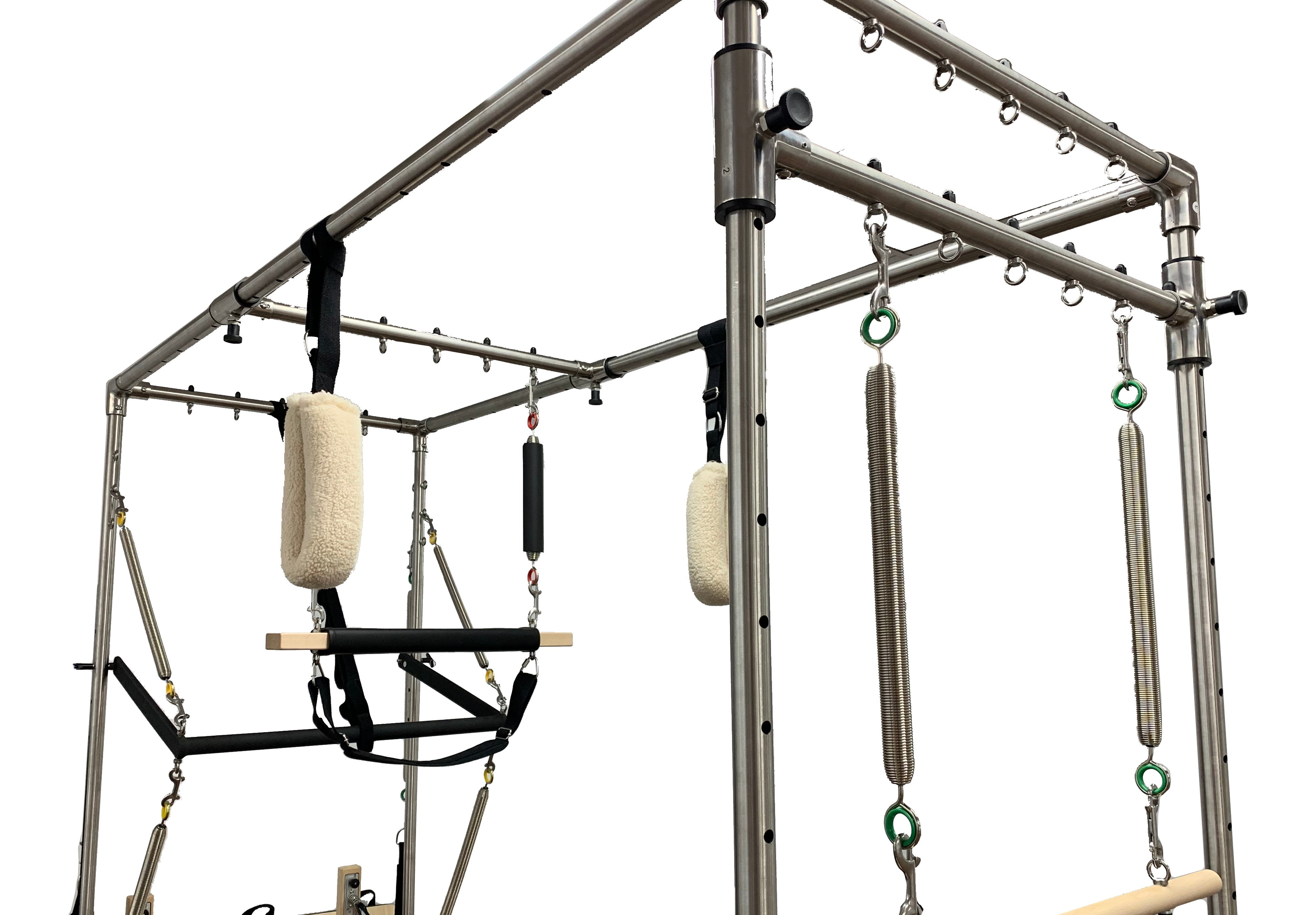 Pilates Clinical Trapeze with various attachments on a white background.