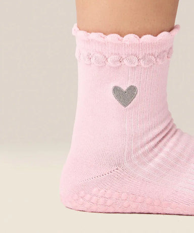 Close up side view of moveactive crew grip socks in heart ruffle pink.