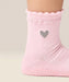 Close up side view of moveactive crew grip socks in heart ruffle pink.