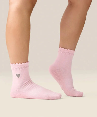 Side view of moveactive crew grip socks in heart ruffle pink.