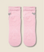 sole view of moveactive crew grip socks in pink ruffle, with grips and logo visible.