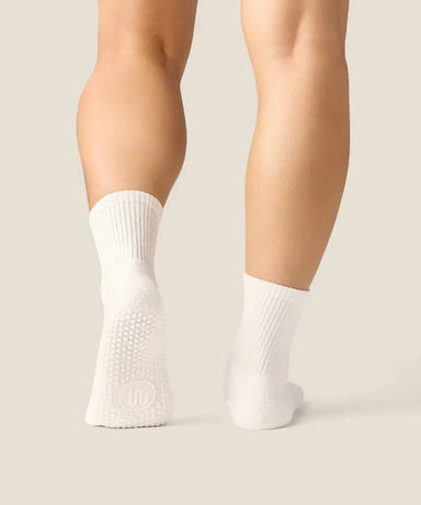 White crew grip socks above ankles with white grips and MoveActive logo on sole.