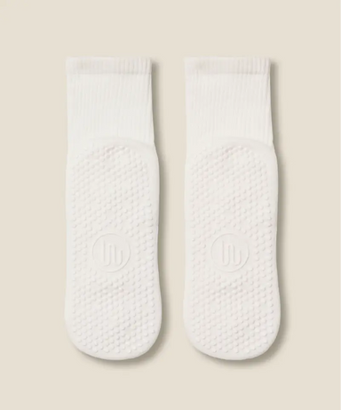 White crew grip socks showing white grips and MoveActive logo on soles.