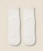 White crew grip socks showing white grips and MoveActive logo on soles.