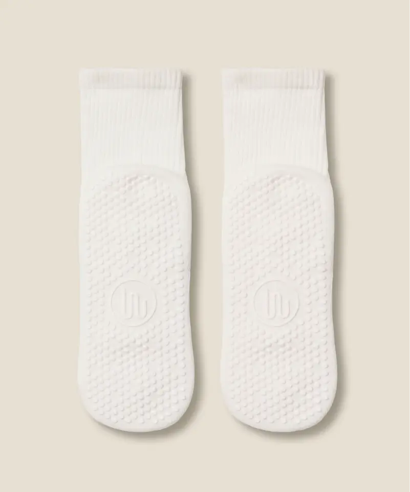 White crew grip socks showing white grips and MoveActive logo on soles.