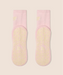 View of the sole of soft pink crew socks with yellow grips and MoveActive logo on the sole, and yellow "pilates club" text on the ankle.
