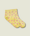 Yellow quarter crew grip socks just above ankle, with ruffle at the top, small pink flowers, and yellow grips and MoveActive logo on the sole.
