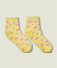 Yellow quarter crew grip socks just above ankle, with ruffle at the top, small pink flowers, and yellow grips and MoveActive logo on the sole.