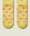 Sole view of yellow grip socks with small pink flowers, and yellow grips and MoveActive logo on the sole.