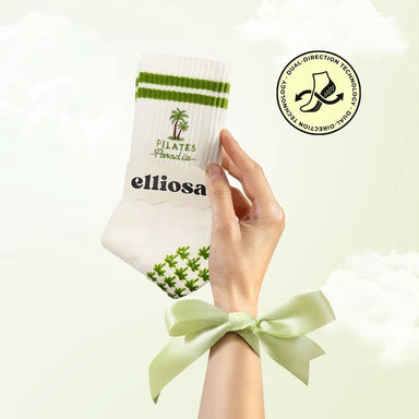 Pilates paradise dual direction grip socks held with green ribbon