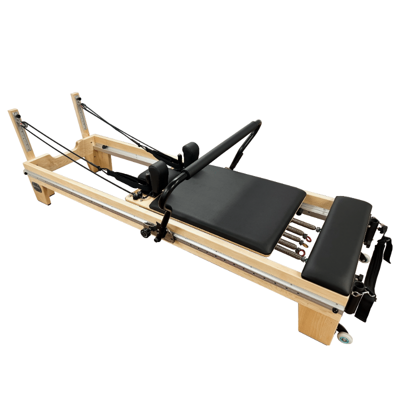 Light wooden clinical pilates reformer with adjustable steel track running the length of the machine. There are 5 colour coded springs.